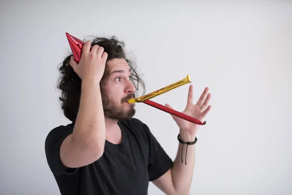 Party man blowing in whistle — Stock Photo, Image