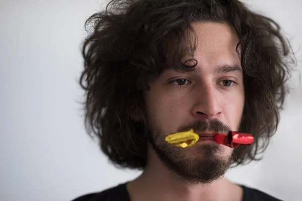 Party man blowing in whistle — Stock Photo, Image