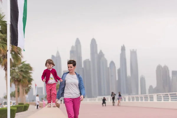 Mother and cute little girl on the promenade — Stock Photo, Image