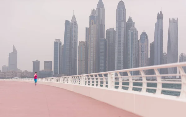 Woman running on the promenade — Stock Photo, Image