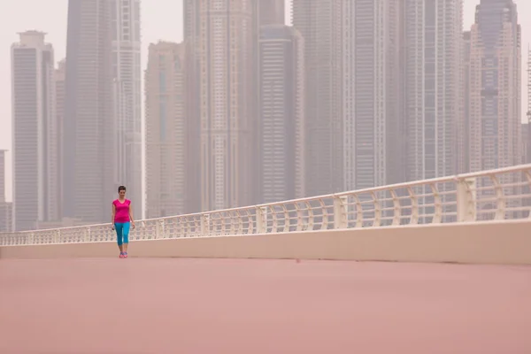 Woman running on the promenade — Stock Photo, Image