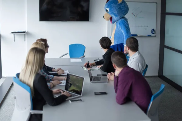 Boss dressed as bear having fun with business people — Stock Photo, Image