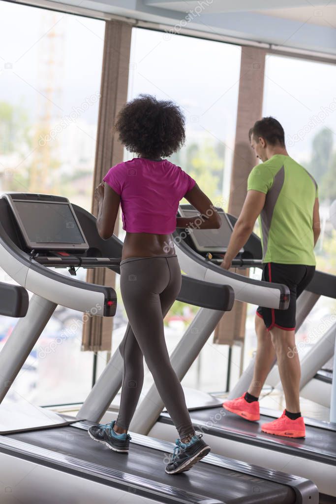 people exercisinng a cardio on treadmill