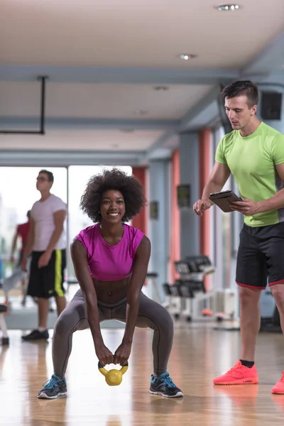 Weights workout with personal trainer at  crossfit gym — Stock Photo, Image