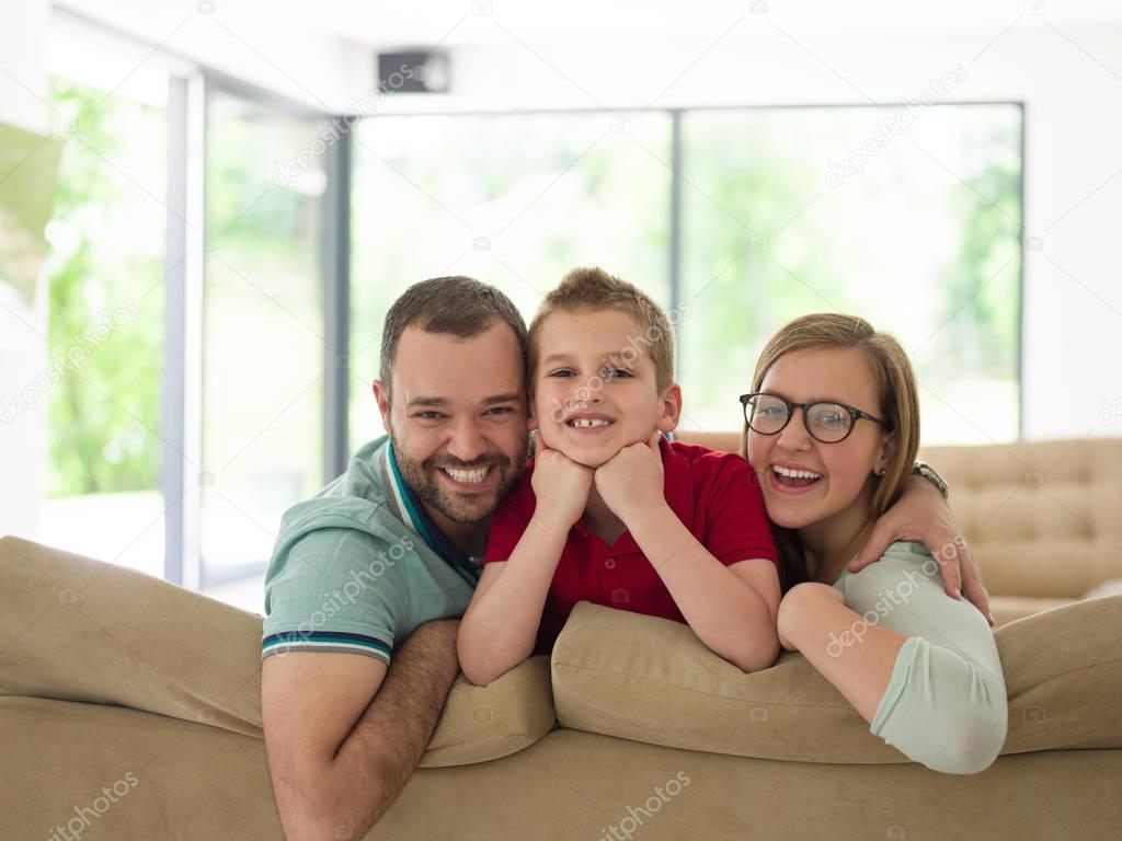 family with little boy enjoys in the modern living room