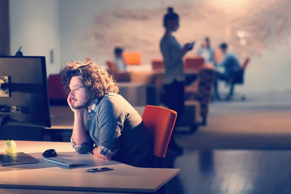 Businessman relaxing at the desk — Stock Photo, Image