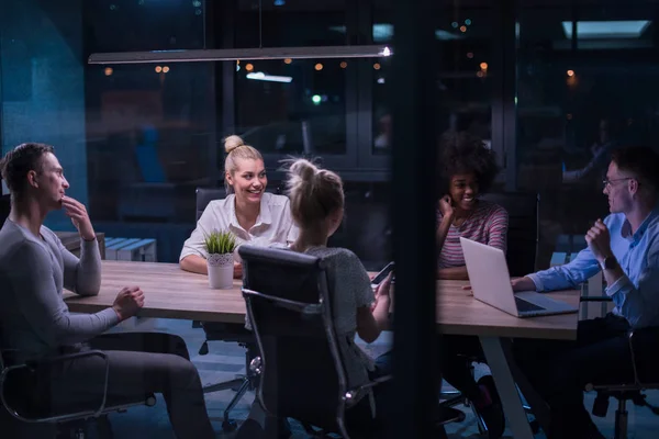 Multiethnic startup business team in night office — Stock Photo, Image