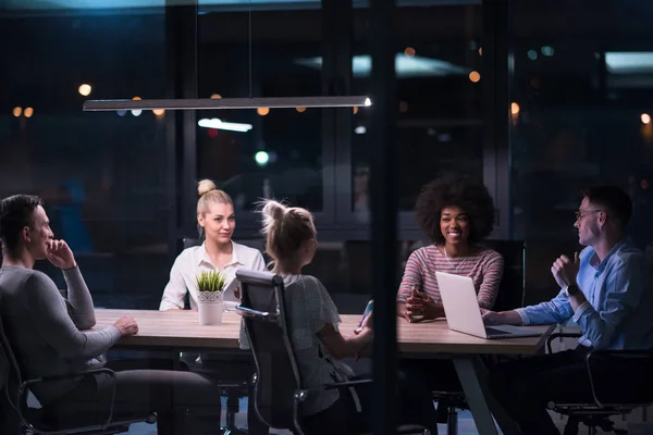 Multiethnic startup business team in night office — Stock Photo, Image