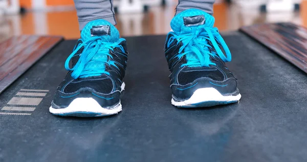 Black female feet in sneakers — Stock Photo, Image