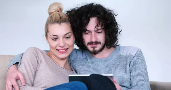 Couple relaxing at  home with tablet computers — Stock Photo, Image