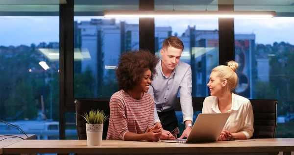 Multiethnic startup business team in night office — Stok Foto