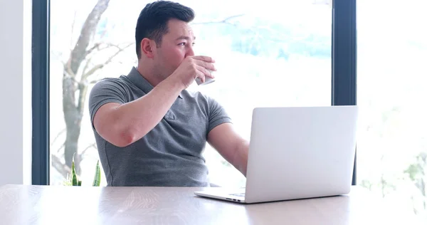 Businessman working using a laptop in startup office — Stock Photo, Image