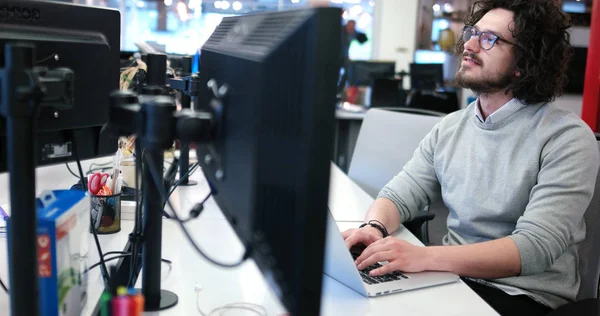 Businessman working using a laptop in startup office — Stock Photo, Image