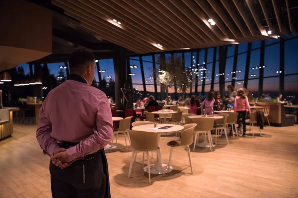 Rear View Young Confident Waiter Standing Hands His Back Luxury — Stok Foto