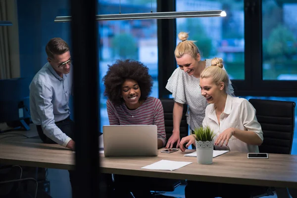 Multiethnic startup business team in night office — Stok Foto