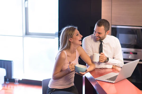 A young couple is preparing for a job and using a laptop — Stock Photo, Image