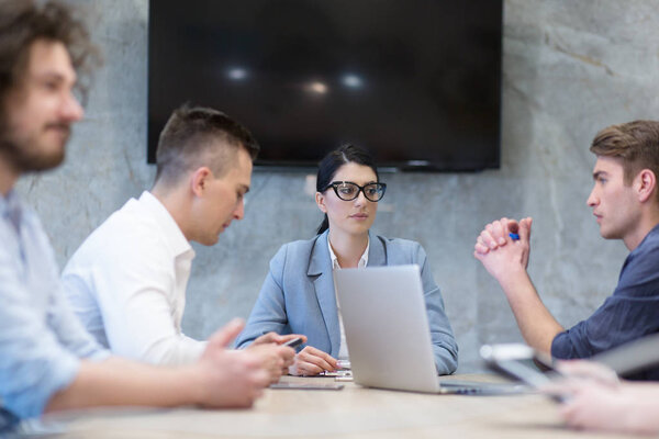 Startup Business Team At A Meeting at modern office building