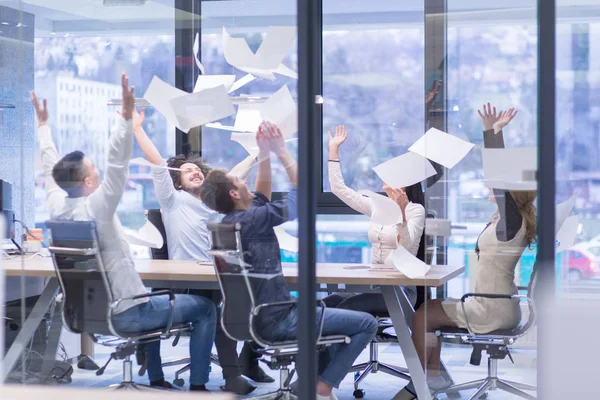 Startup Group of young business people throwing documents — Stock Photo, Image