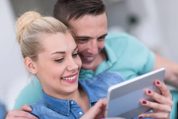 Couple relaxing at  home with tablet computers — Stock Photo, Image