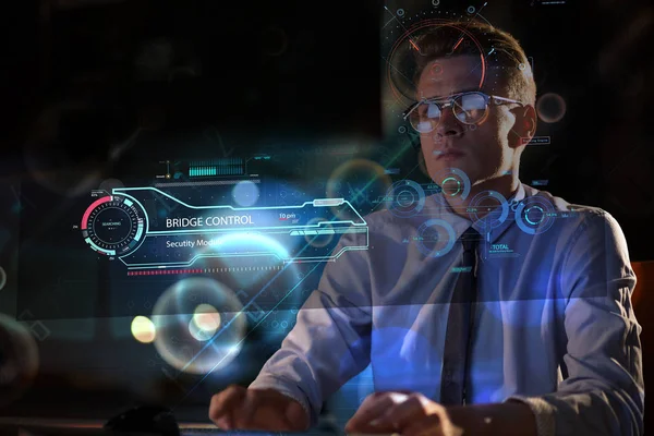 Man working on computer in dark office — Stock Photo, Image