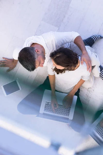 Couple using tablet and laptop computers top view — Stock Photo, Image