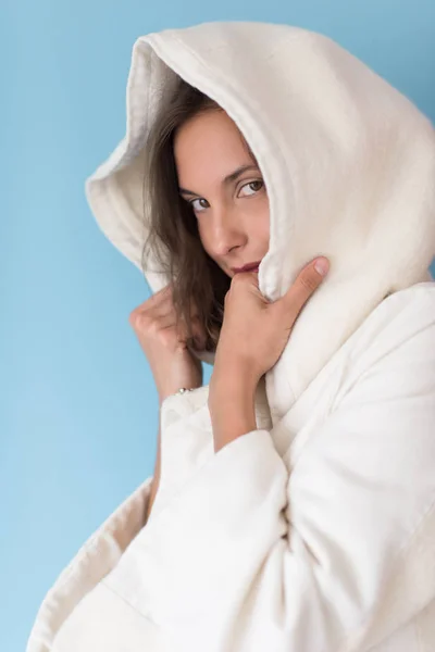 Woman in a white coat with hood — Stock Photo, Image