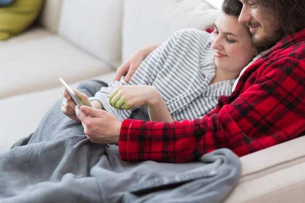 Couple relaxing at  home with tablet computers — Stock Photo, Image