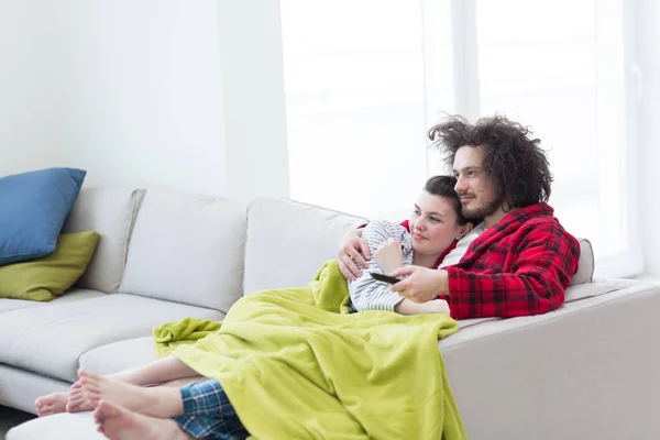 stock image Young couple on the sofa watching television