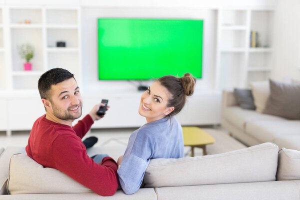 Young couple on watching television