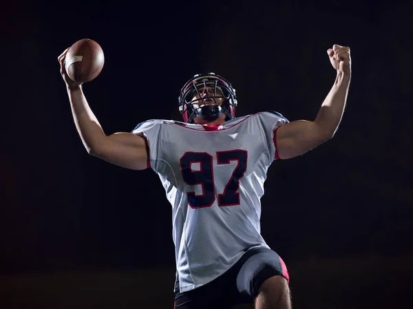 Jogador de futebol americano comemorando depois de marcar um touchdown — Fotografia de Stock