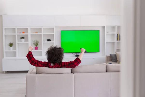 Hombre joven en albornoz disfrutando del tiempo libre — Foto de Stock