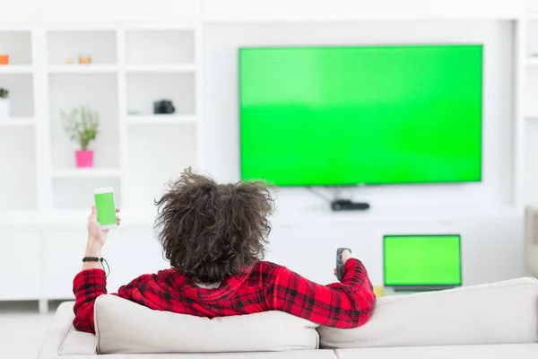 Young man in bathrobe enjoying free time — Stock Photo, Image