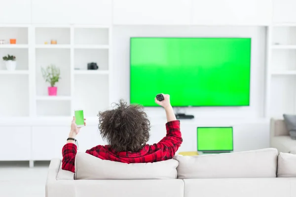 Young man in bathrobe enjoying free time — Stock Photo, Image