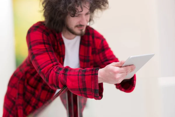 Young freelancer using tablet computer — Stock Photo, Image