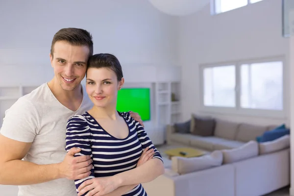 Couple hugging in their new home — Stock Photo, Image