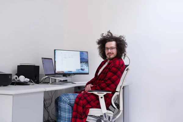 Graphic designer in bathrobe working at home — Stock Photo, Image