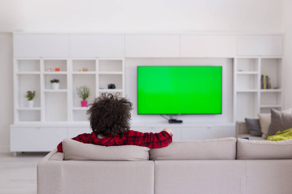 young man in bathrobe enjoying free time