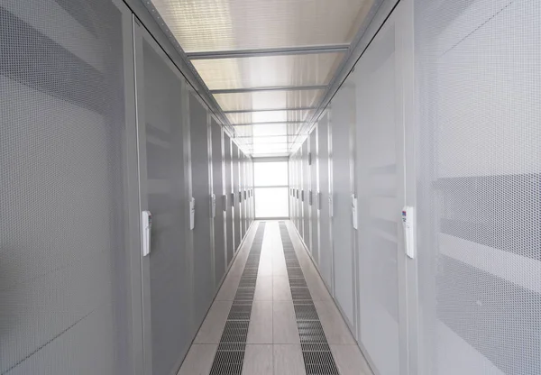 Modern server room with white servers — Stock Photo, Image