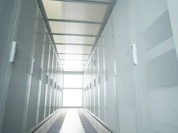Modern server room with white servers — Stock Photo, Image