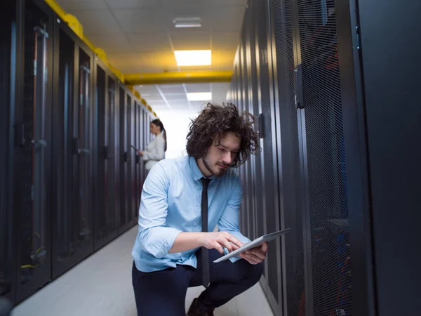 Engineer showing working data center server room to female chief — Stock Photo, Image