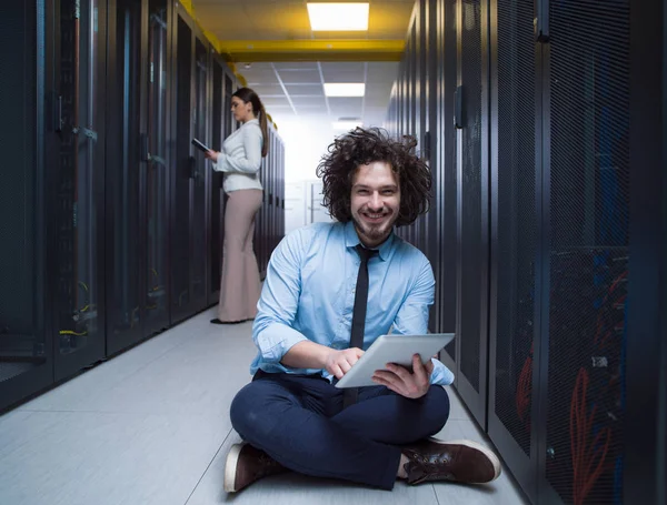 Engineer showing working data center server room to female chief — Stock Photo, Image