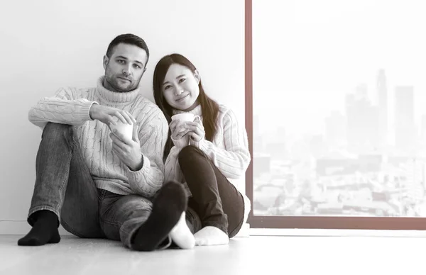 Happy Young Multiethnic Couple Enjoying Morning Coffee Window Cold Winter — Stock Photo, Image