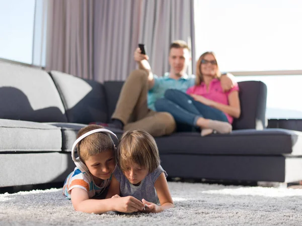 Happy Young Family Playing Together Home Kids Using Tablet Floor — Stock Photo, Image