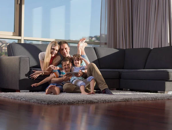 Happy Young Family Playing Together Tablet Home Sitting Sofa — Stock Photo, Image