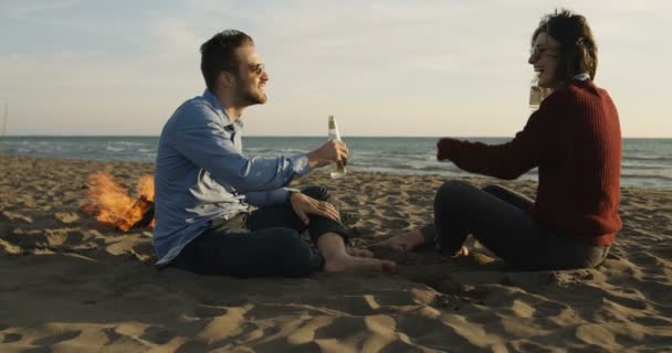 Young Couple Relaxing Fire Drinking Beer Drink Bottle — Stock Video