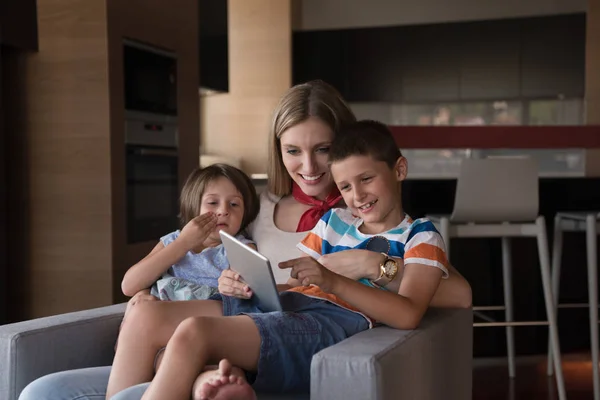 Happy young mother spending time with kids — Stock Photo, Image