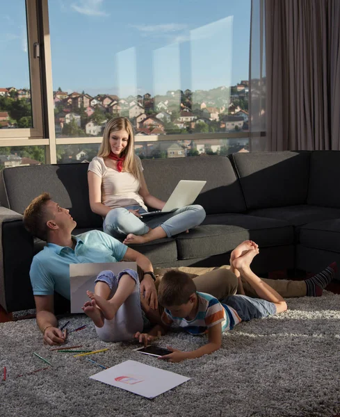 Happy Young Family Playing Together Home Floor Using Laptop Computer — Stock Photo, Image