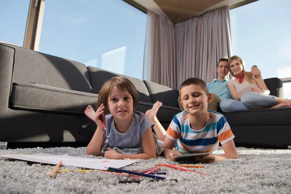 Happy Young Family Playing Together Home Floor Using Tablet Children — стоковое фото