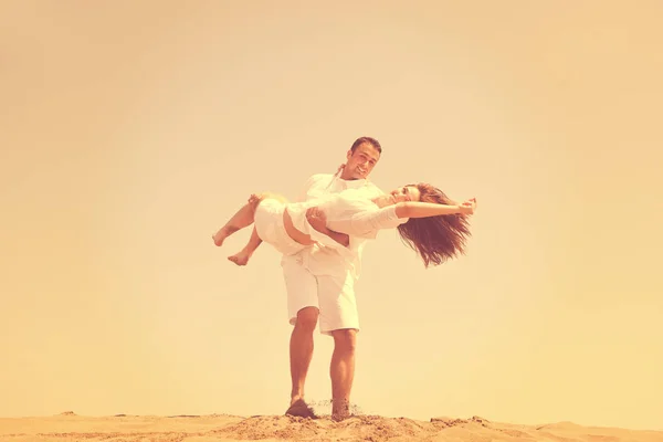 Happy young couple have fun on beach — Stock Photo, Image