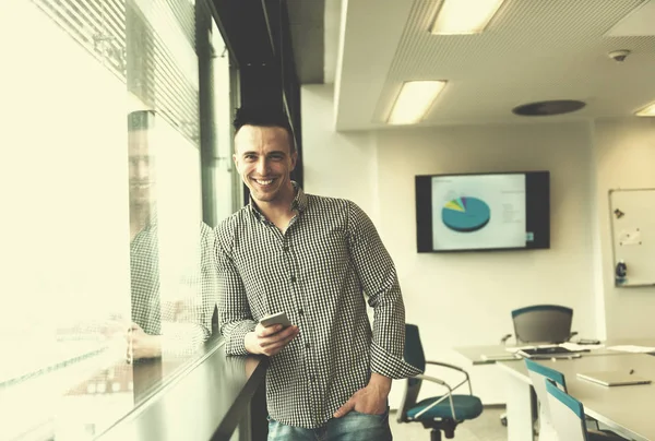 Relaxed Young Businessman Using Smart Phone Modern Startup Business Office — Stock Photo, Image